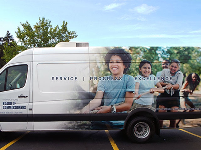 commissioners van with happys people image on the side